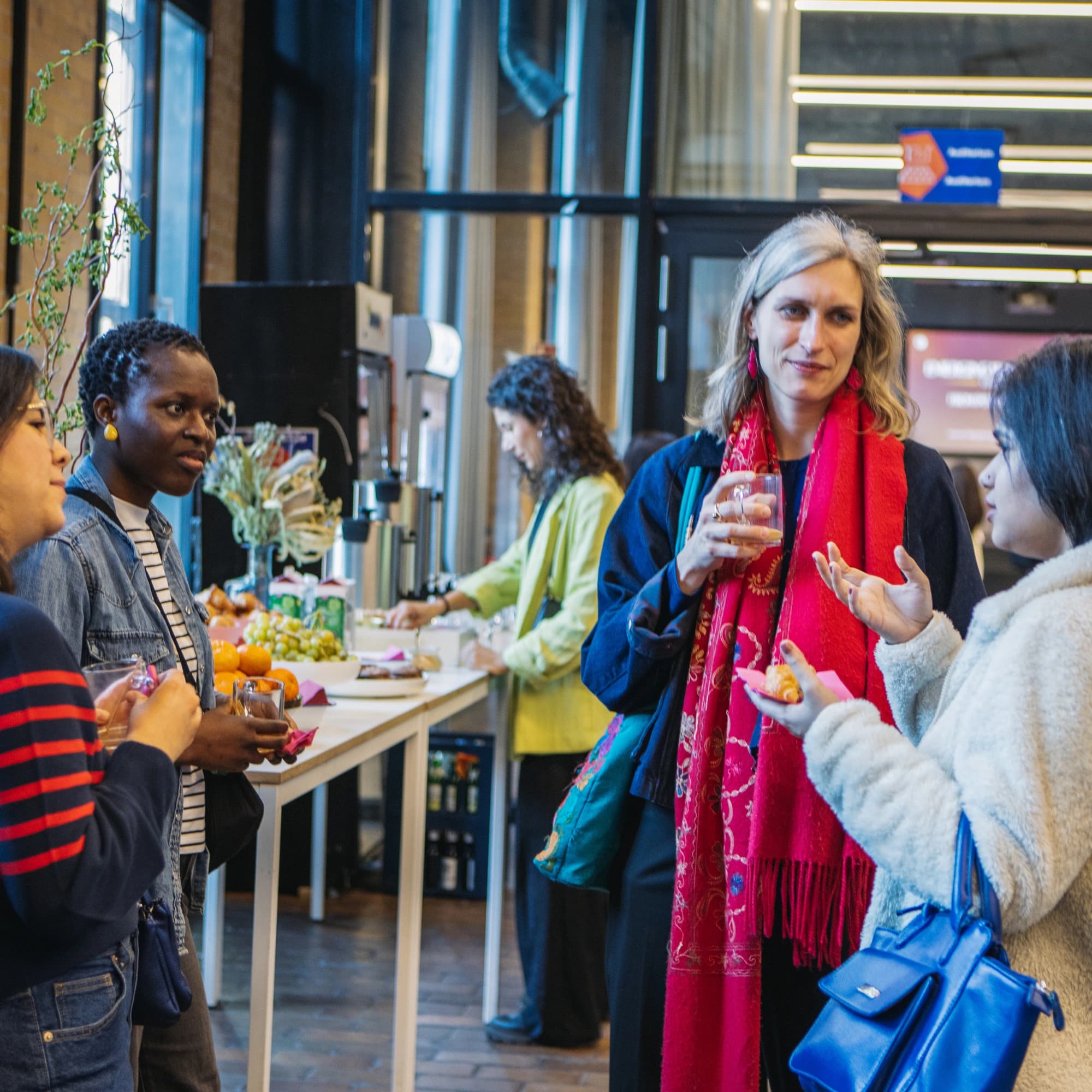 Conference participants in conversation