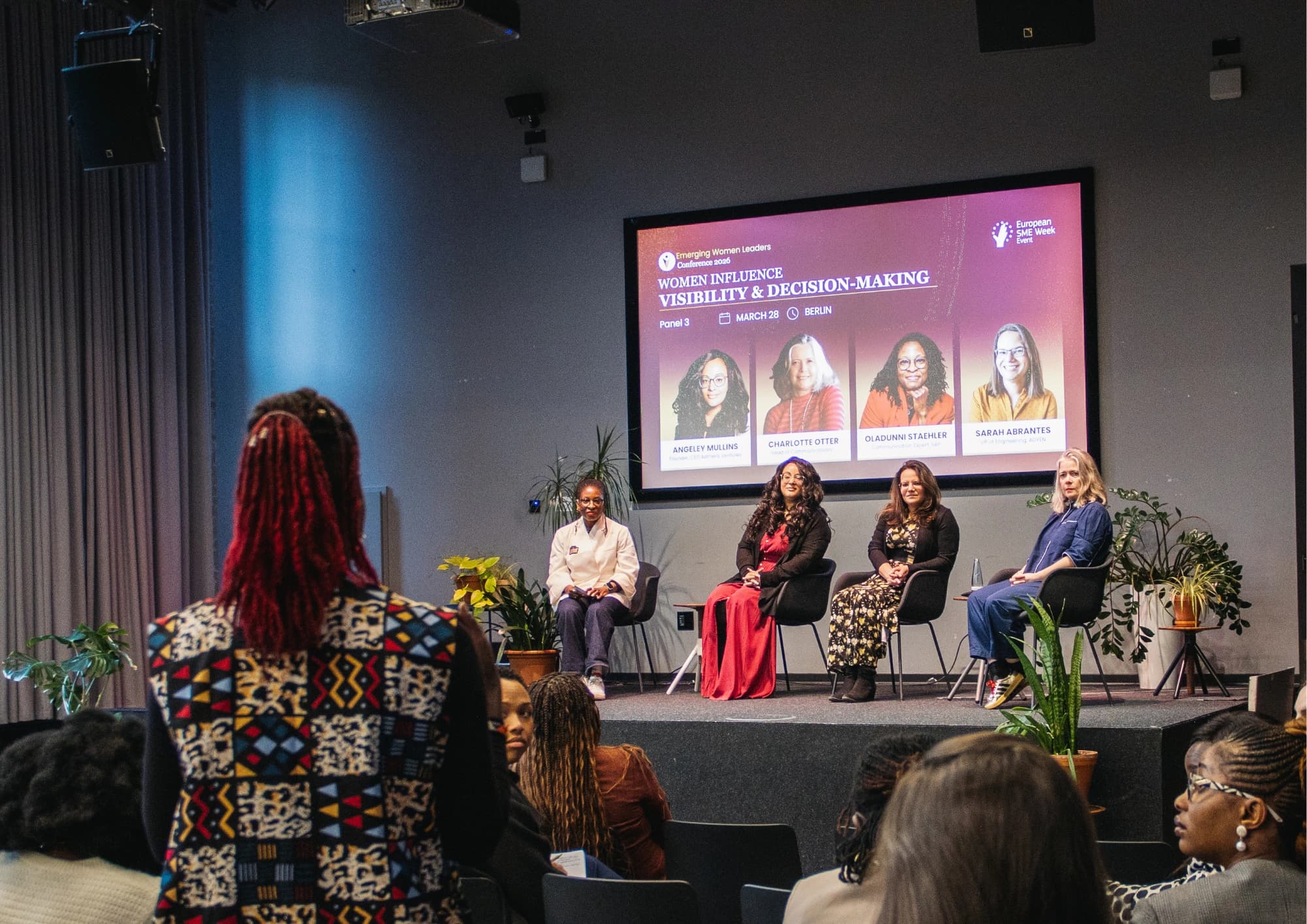 Women leaders on stage at the conference